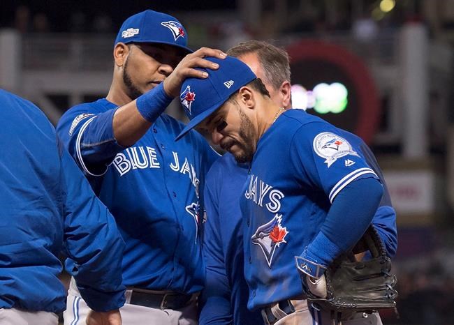 Blue Jays second baseman Travis leaves ALCS opener with apparent leg injury | iNFOnews.ca