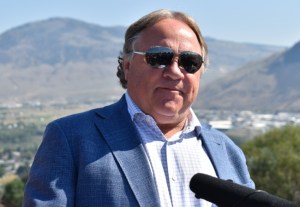 A photo of Reid Hamer-Jackson with a mountainous background.