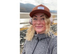 Blonde woman wearing a hat.