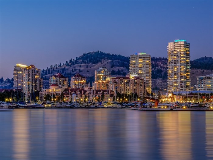 A city on a lake at night.