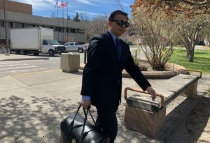Rogelio Bagabuyo photographed walking from a courthouse.
