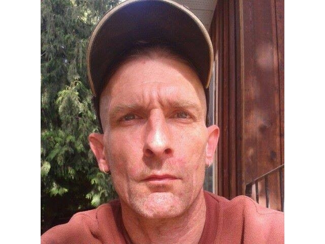 A photo of a man in a ballcap.