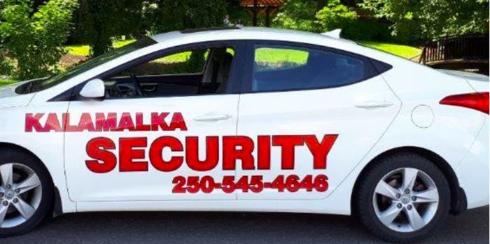 White car stencilled with company name in red letters