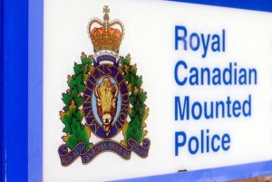 A close-up of the RCMP logo on a sign.