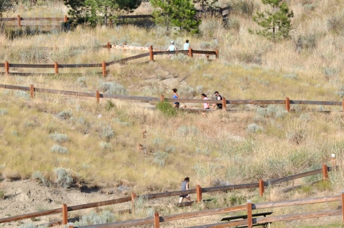 People hiking up Knox Mountain.