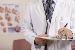 An image of a doctor holding a clipboard.
