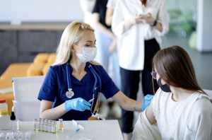 Health care worker vaccinates a patient.