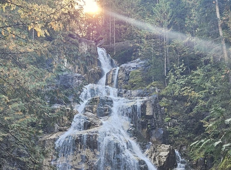 A waterfall cascades down rocks.