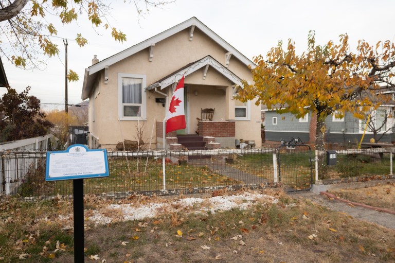 A plaque is installed in front of a residential family home.