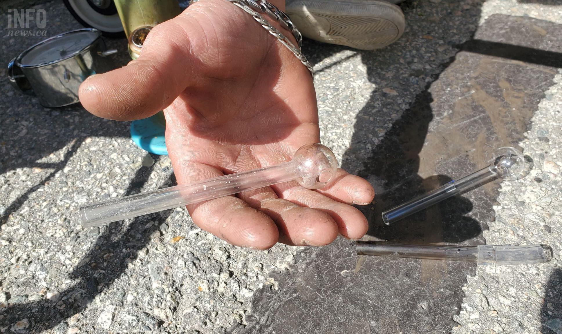 Close-up photo of a pipe in a man's hand.