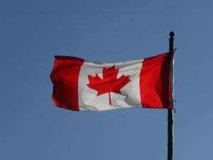 A Canada flag waves in the breeze.