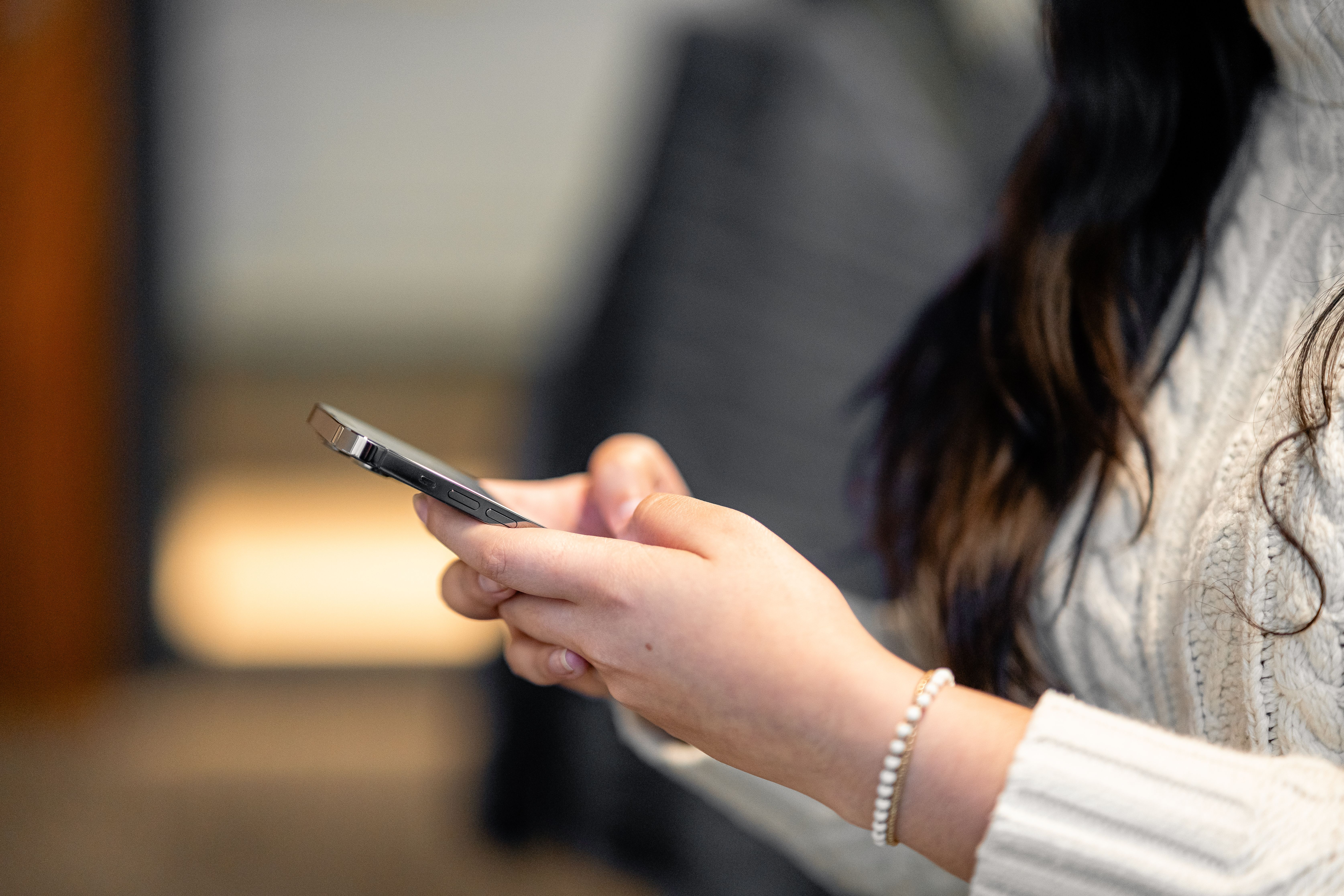 A person looks at their phone.