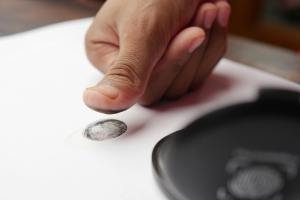 A person's thumb gives a fingerprint.