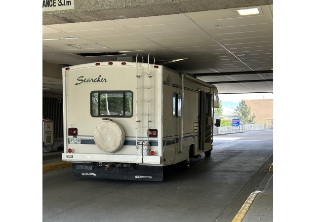 An RV stopped in a drive-thru entrance where it struck the ceiling.