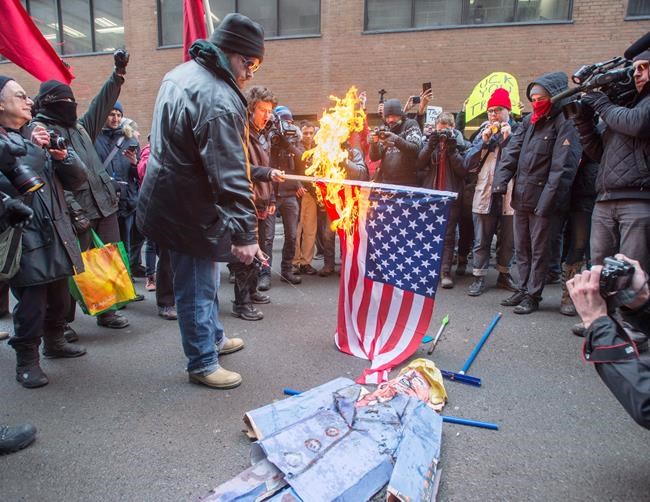 Montrealers march and burn U.S. flag in protest of Trump's inauguration | iNFOnews.ca Montrealers march and burn U.S. flag in protest of Trump's inauguration | iNFOnews.ca