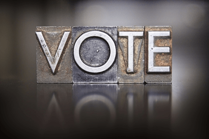 The word vote in old fashion metal type.