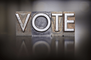 The word vote in old fashion metal type.