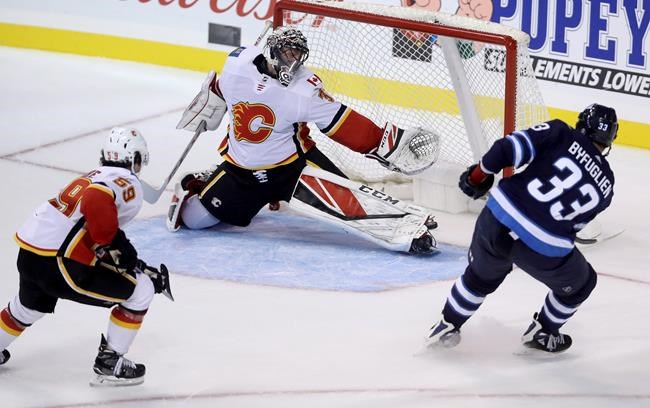 Dustin Byfuglien scores in overtime, Jets beat Flames 4-3 in pre-season | iNFOnews.ca CP911142641